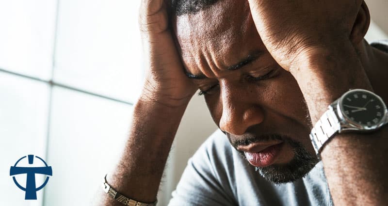 man in distress, holding head