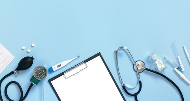 clipboard and medical instruments on light blue background