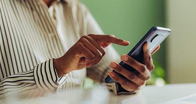 PrimaryCare_2022-0328_MakingLivingWill person tapping their phone