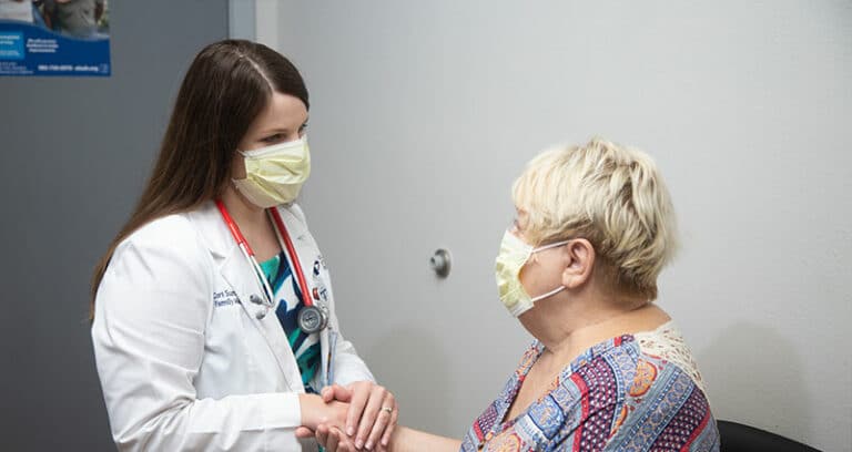 Medical Professional speaking with patient