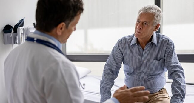 Man listening to doctor