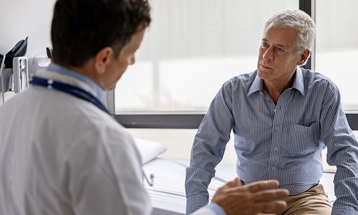 Man listening to doctor