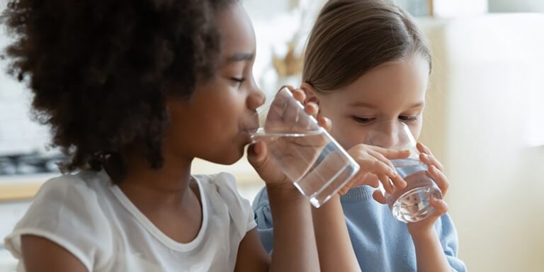 ChildrensHealth_2022-0616_HydrationGuideKids girls drinking glasses of water