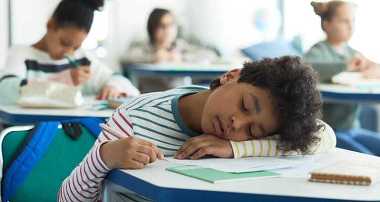 boy sleeping in class