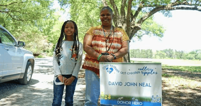 OrganDonation_Kim adult and child standing side by side outdoors