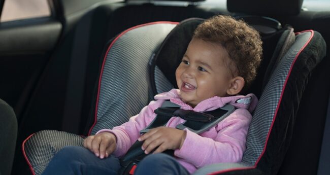 ChildrensHealth_2022-0822_CarSeatSafetyYears smiling kid in car seat