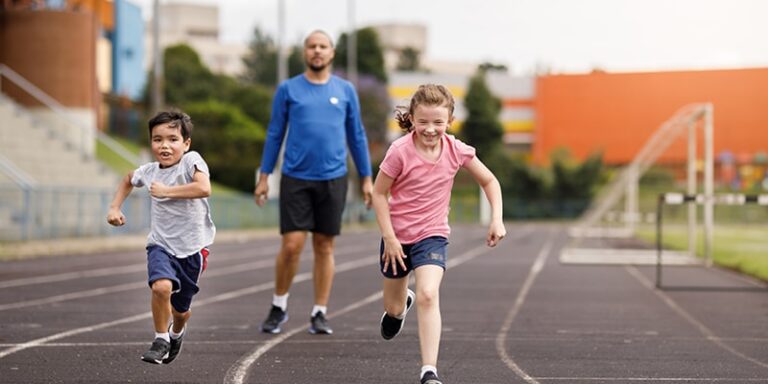 kids running on track with parent