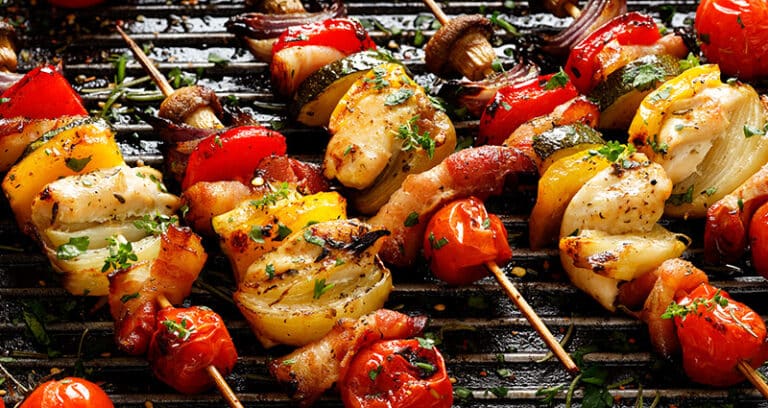 skewered veggies and chicken on grill