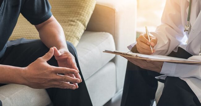 PrimaryCare_20220901_WhenShouldMenStartWorryingProstate man listening to his provider