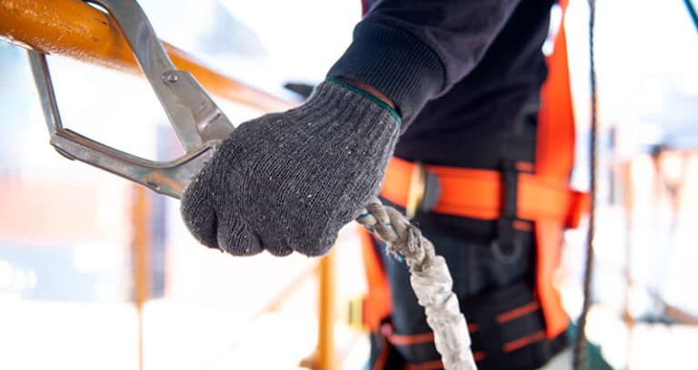worker holding a safety device