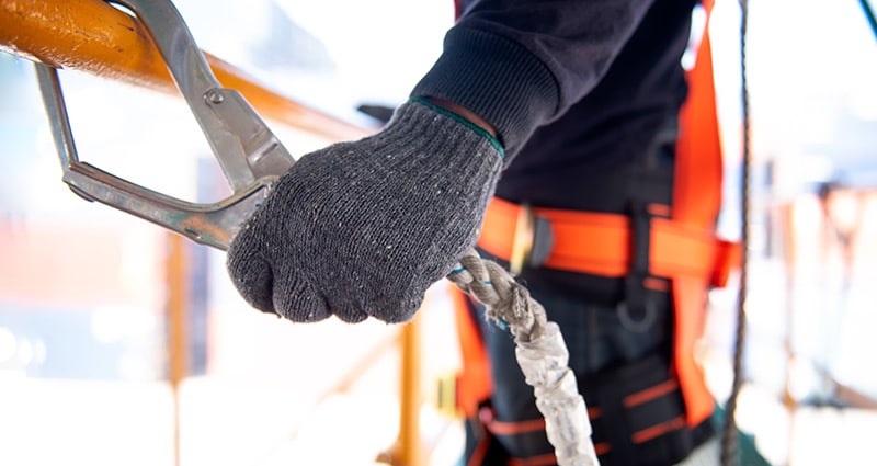 worker holding a safety device