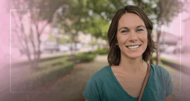 happy woman standing outside