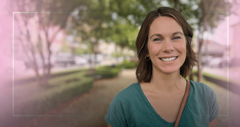 happy woman standing outside