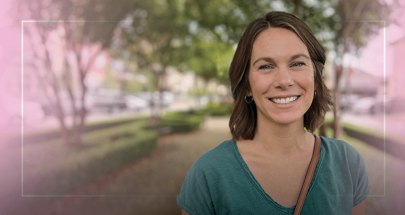 happy woman standing outside