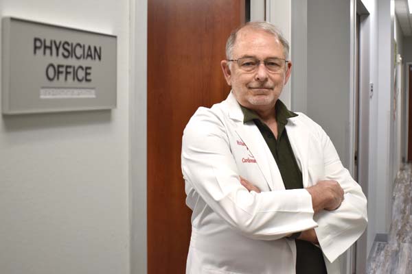 medical professional standing in hallway