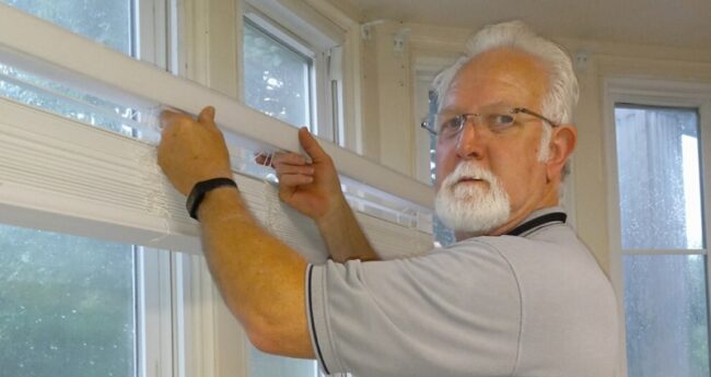 StFranStrokePatient_BlogHeader senior hanging window blinds indoors