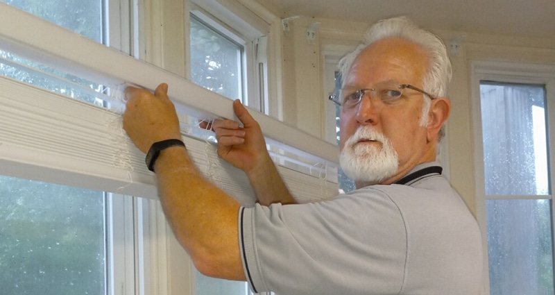 senior hanging window blinds indoors