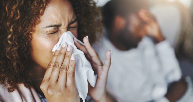 Seasonal_20231031_BoostYourImmuneSystem woman blowing her nose