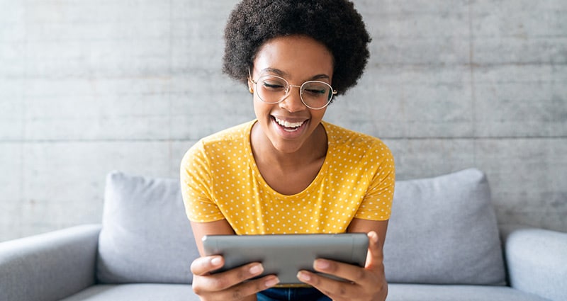 woman looking at a tablet