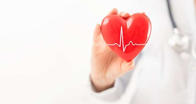 EatingWell_20210205_7HealthTipsTakeToHeart provider holding red heart-shape