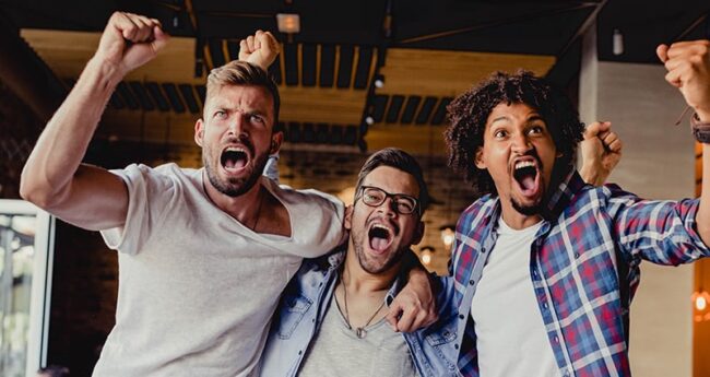 HeartHealth_20210106_IsRootingTooHardBadForHeart three friends excitedly cheering their team
