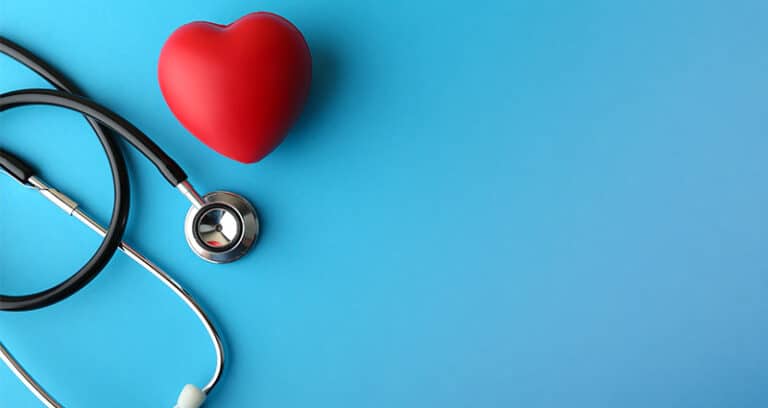 stethoscope and heart-shaped stress ball