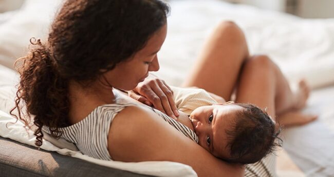woman breastfeeding her baby
