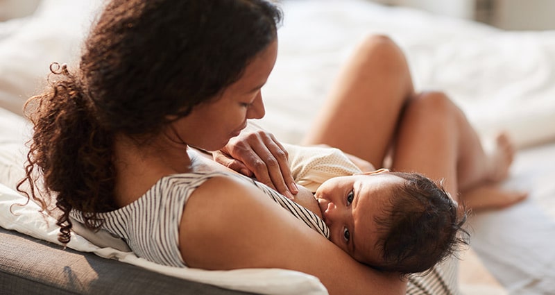 woman breastfeeding her baby