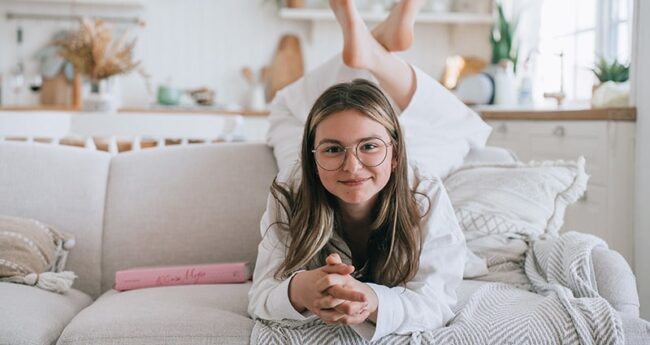 tween girl on a couch