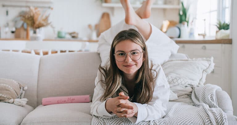 tween girl on a couch
