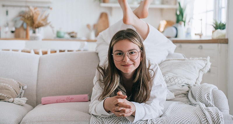tween girl on a couch