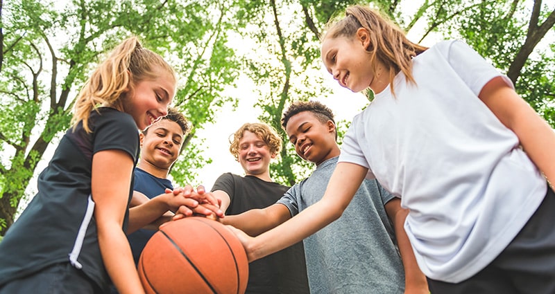 Teens getting ready to play basketball