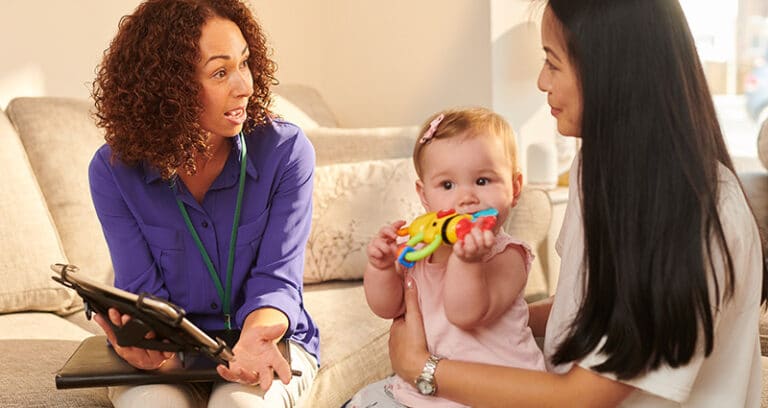 social worker talking to mom and baby