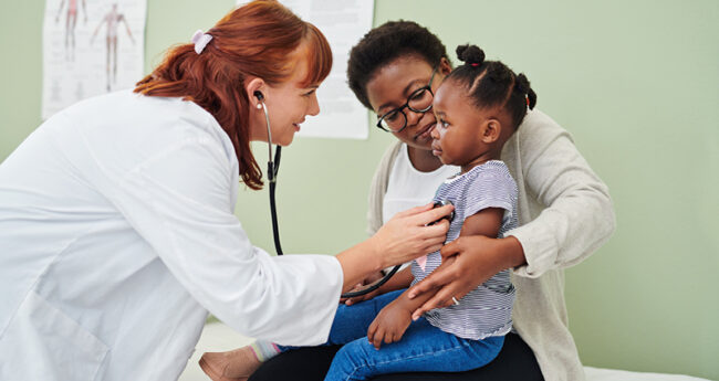 Doctor with mom and child
