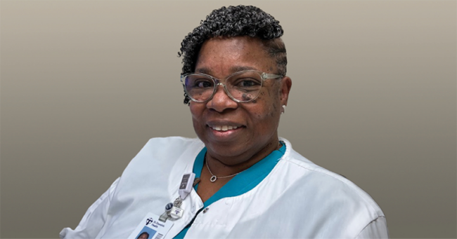 blog A woman wearing nurses clothes smiles at the camera