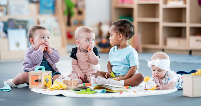 Group of babies playing together
