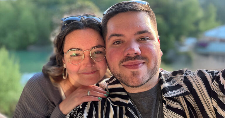 A man and a woman pose for a photo together